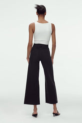 Pantalon large à lisière brute en noir, coupe slim, taille haute, coupe droite